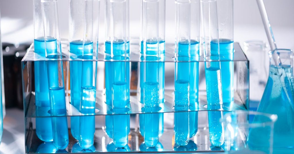 Close-up of blue liquid in test tubes for chemistry experiments in a laboratory setting.